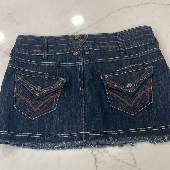 Denim miniskirt with leather trim on pockets and fringed hem - Picture 2 of 3